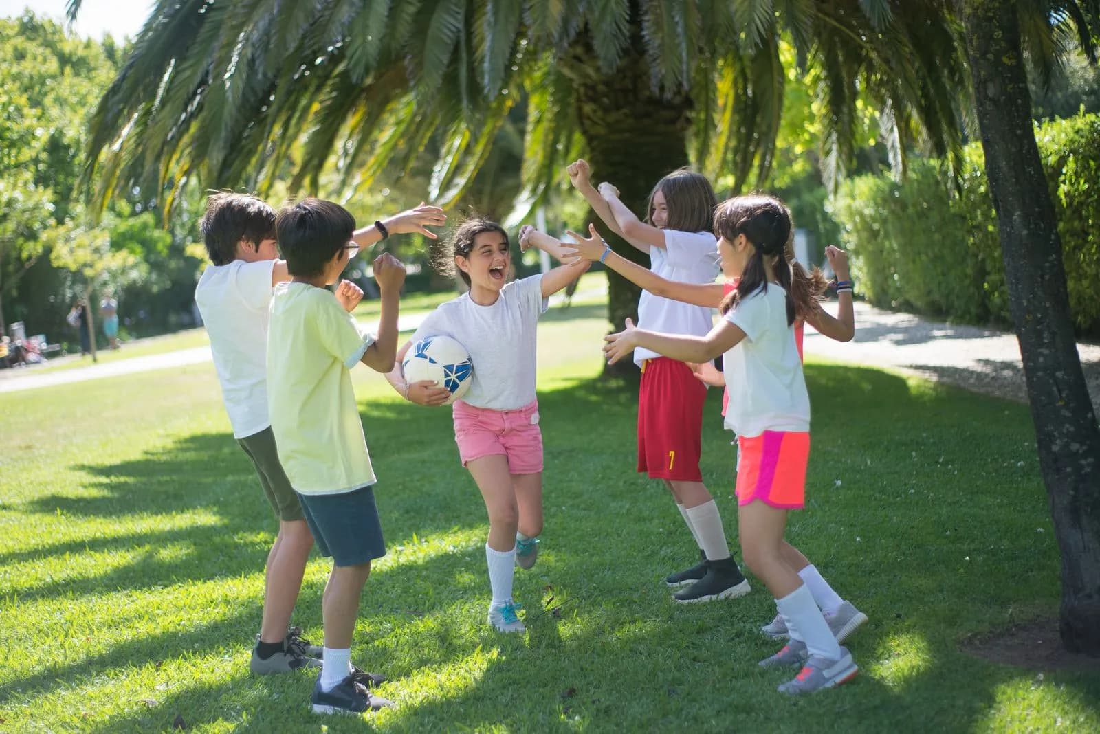 Children celebrating on a field after a game